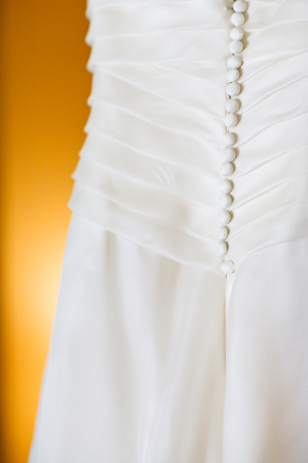 photo by San Francisco based wedding photographer Ben Chrisman - button details on white wedding dress